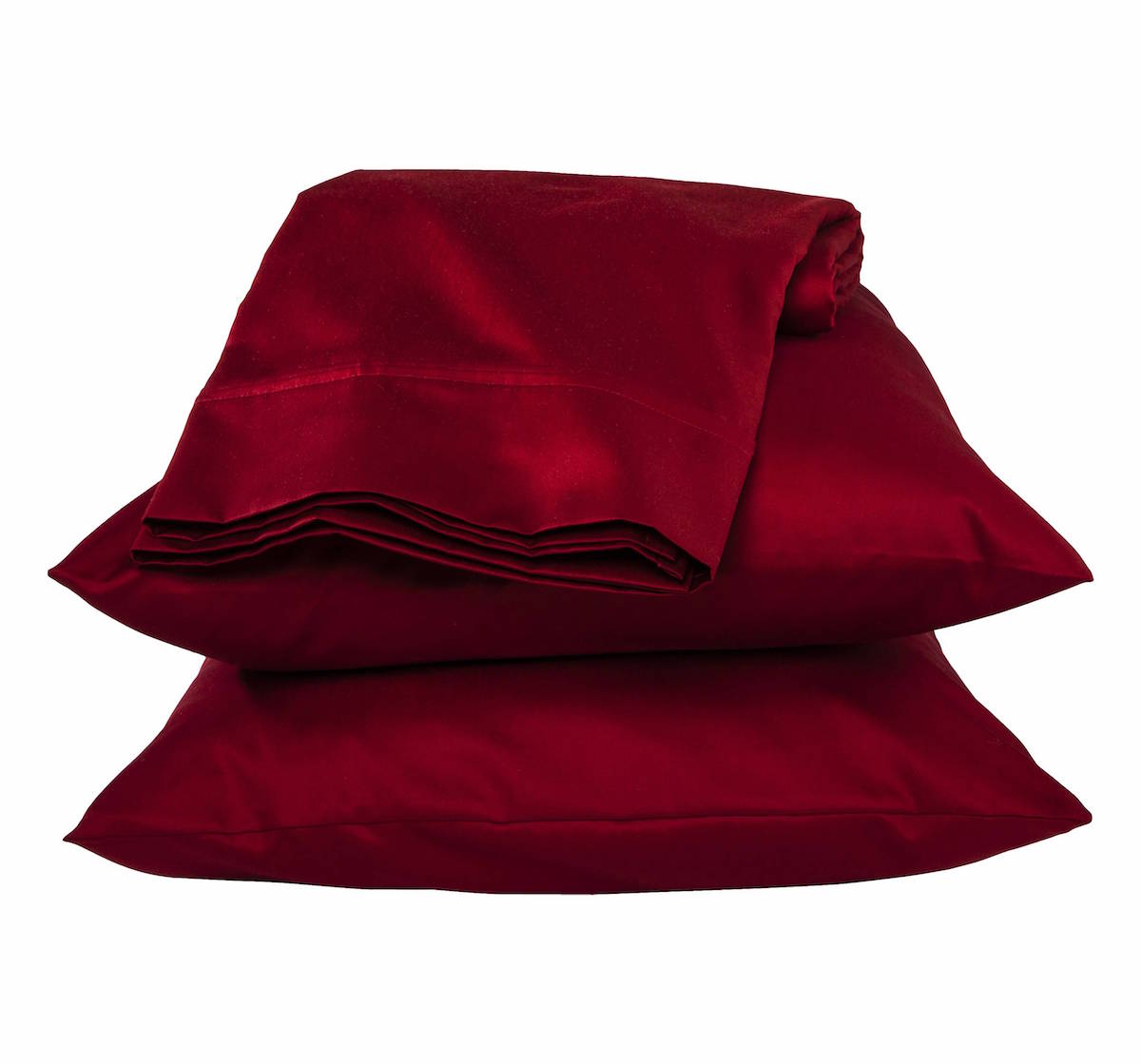 A stack of two pillows in pillow cases plus sheets folded up on top of them. They are red.