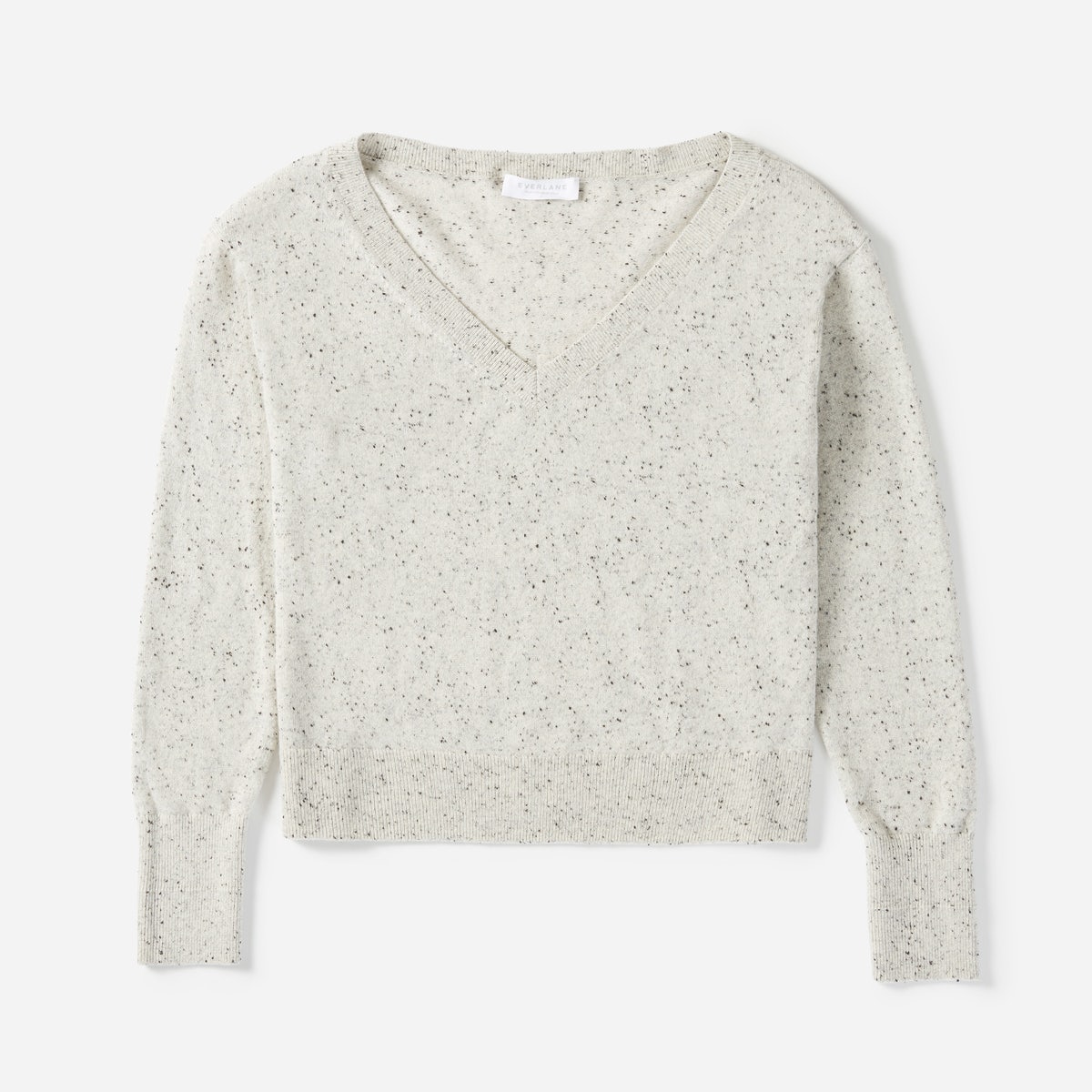 Everlane Cashmere Crop V-neck sweater in frost donegal, a light gray with dark specks.