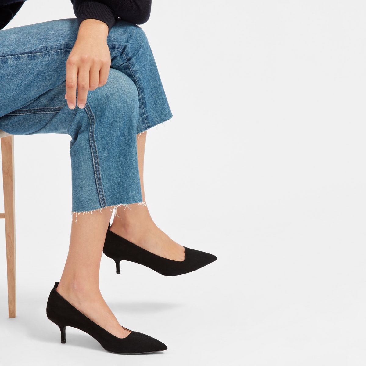 Everlane editor heels in black, as shown on a model's feet.