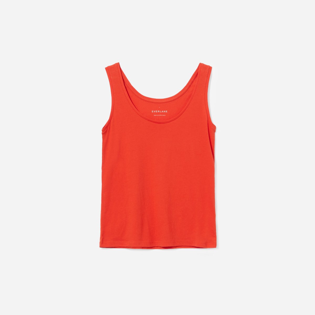 stock photo of everlane relaxed cotton tank in poppy, an orangy color