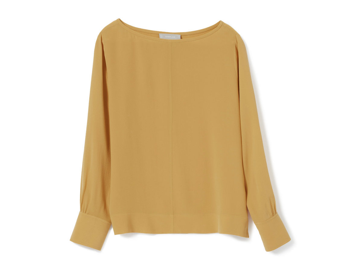 Stock photo of the Everlane Clean Silk Boatneck blouse in mustard gold.