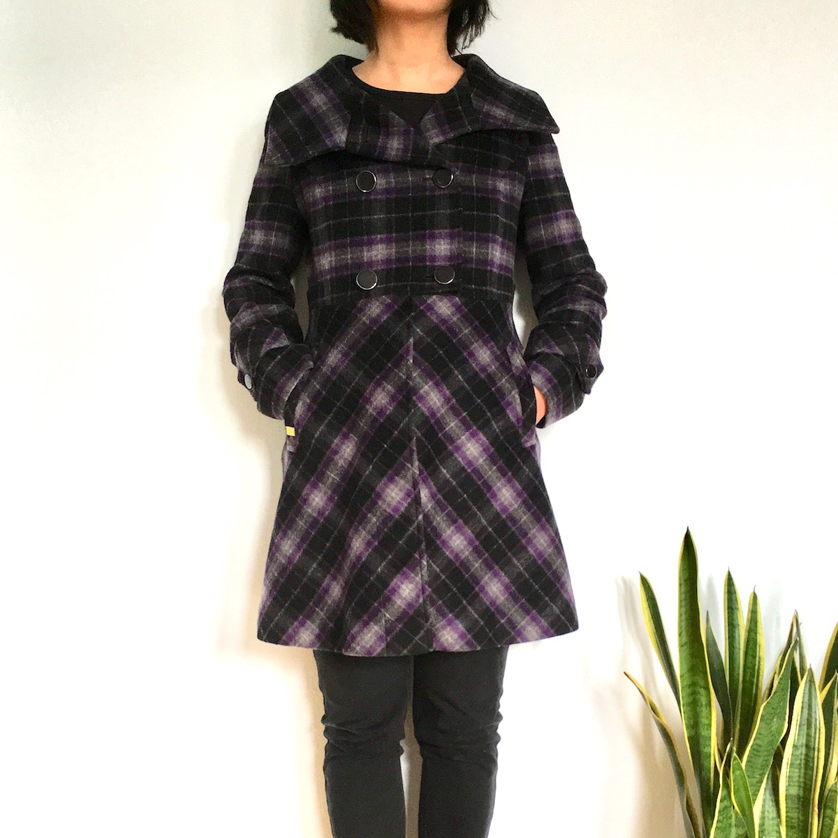 Selling on Poshmark: Tips from a Posh Ambassador: A woman with dark hair models a purple and black plaid coat
