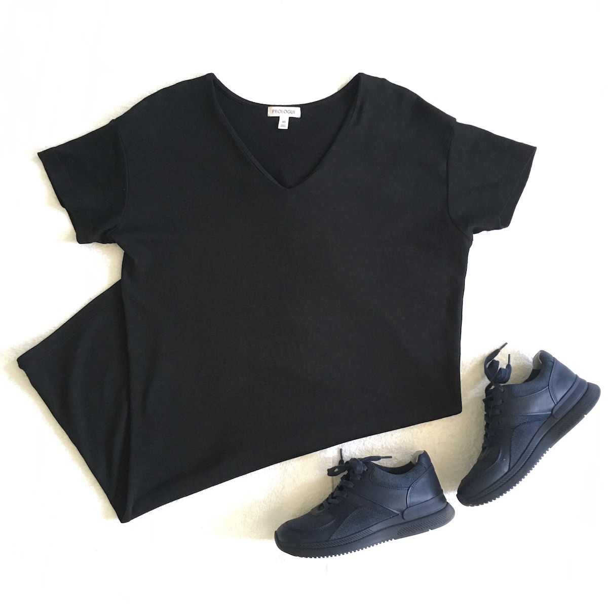 Welcome Objects Shopping Diary: Flat lay image of a black T-shirt dress from Target's Prologue brand and Everlane trainers.