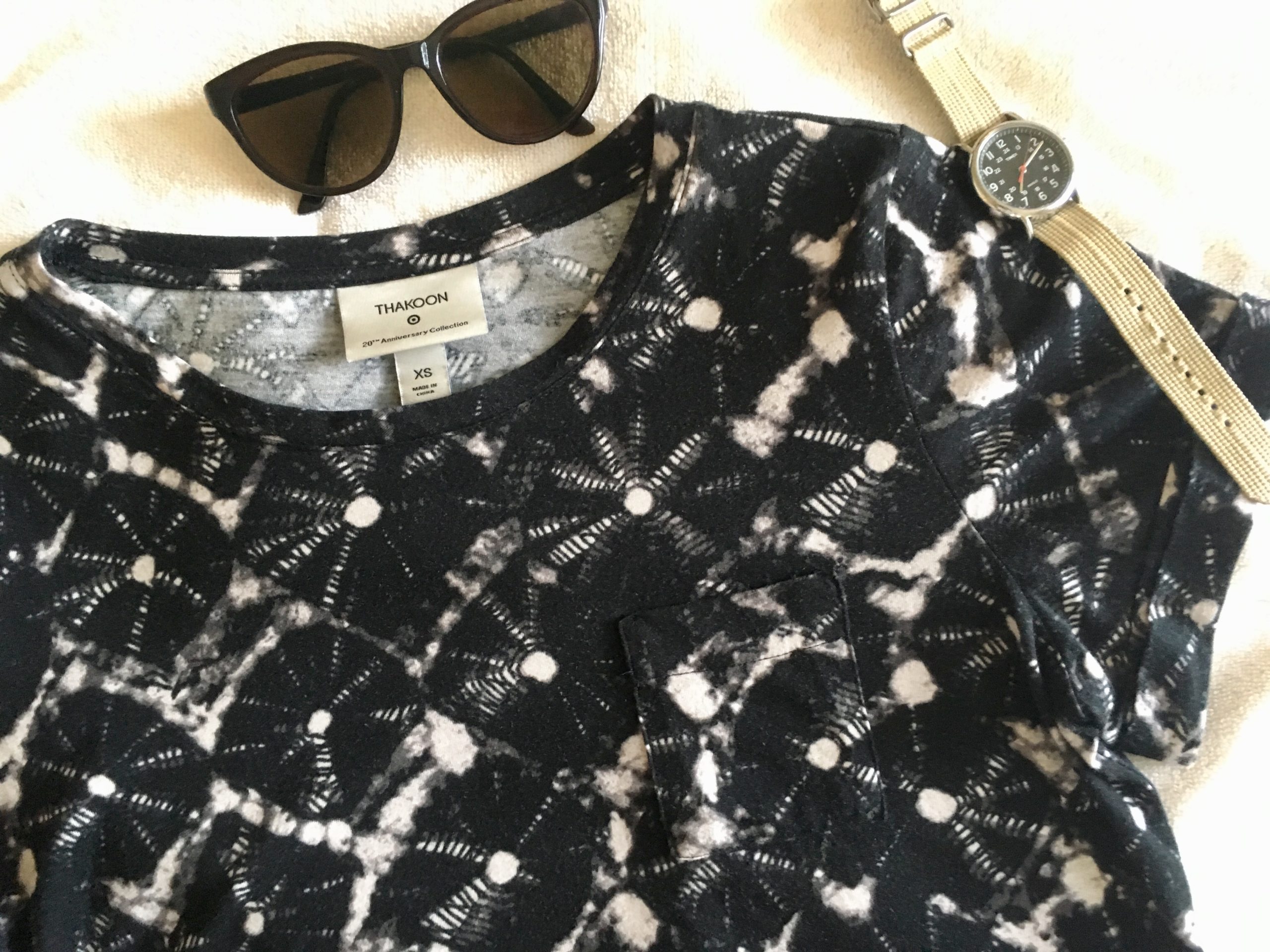 Thakoon for Target shibori print black and cream T-shirt with sunglasses on a white surface.