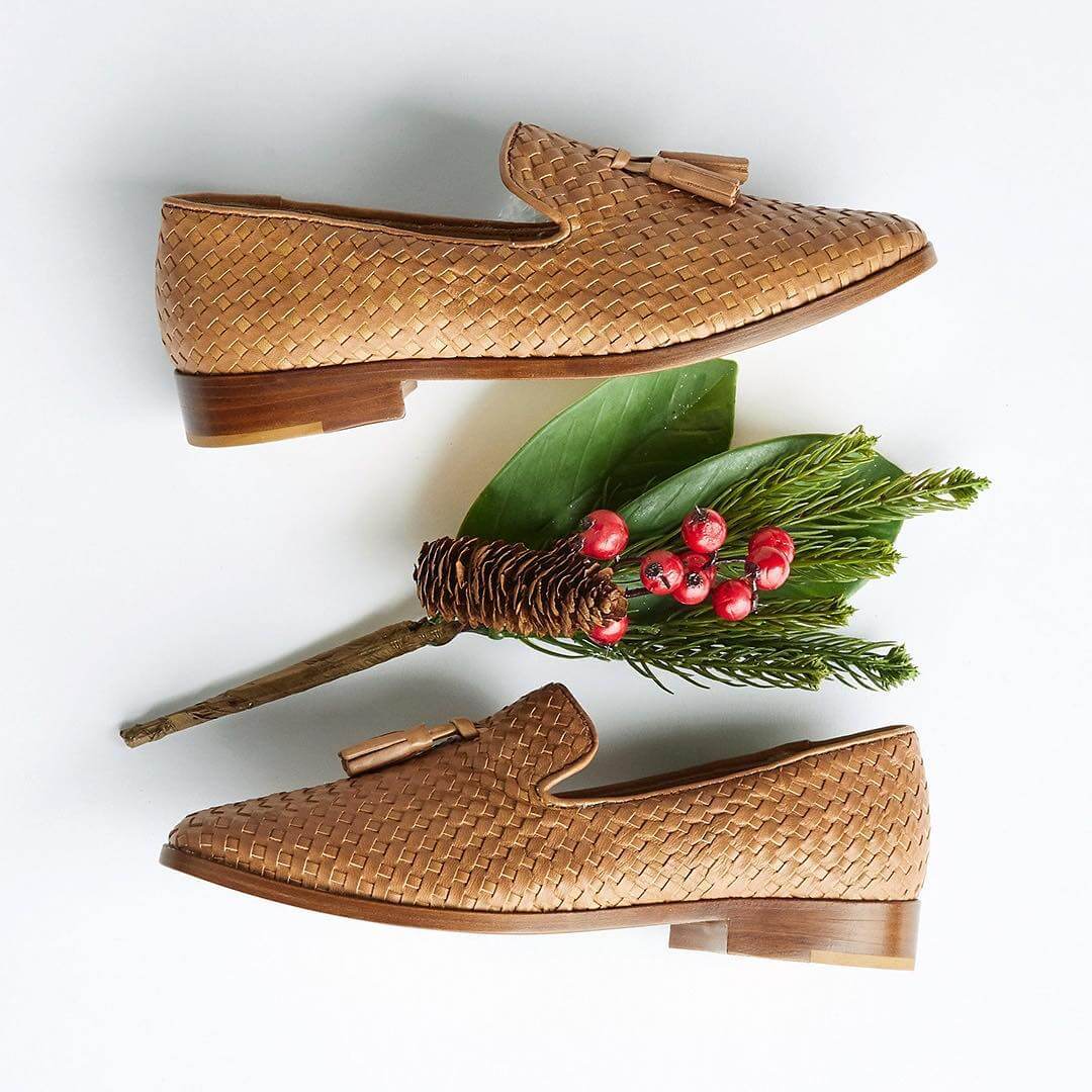 Ethical Black Friday and Cyber Monday: Woven loafers with a stick of holiday leaves and berries.
