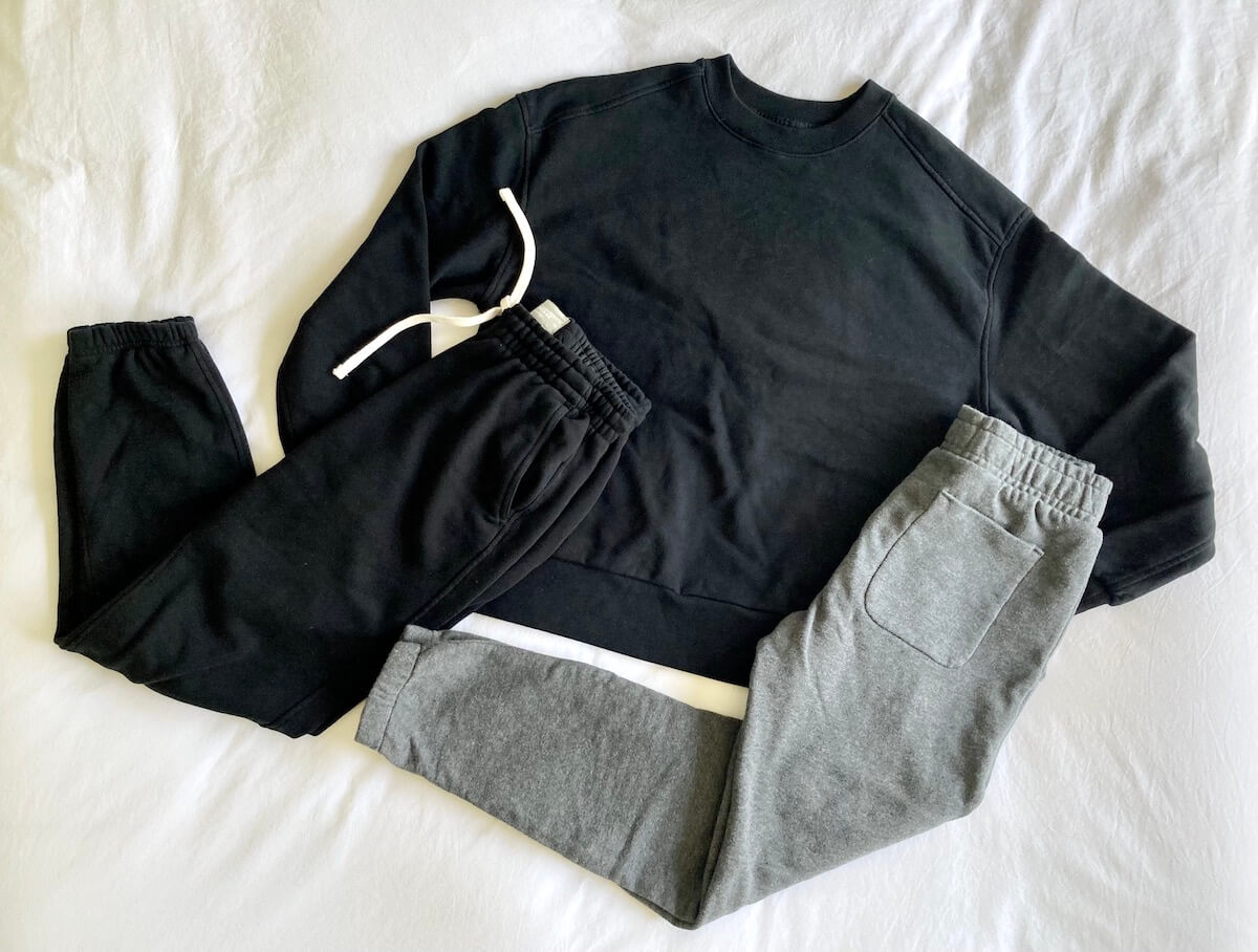A sweatshirt and two sweatpants from the Everlane Track Collection.