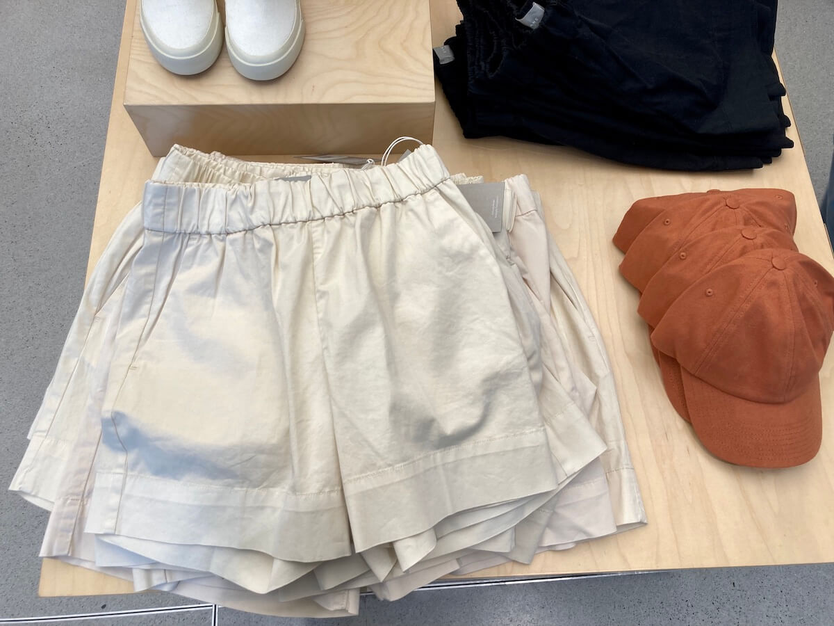 A display in an Everlane store with a stack of easy shorts.