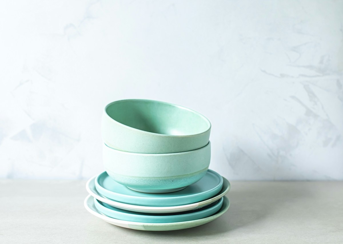 A stack of blue bowls and plates.