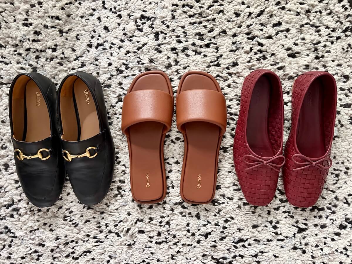 Three pairs of Quince shoes on a black and white rug